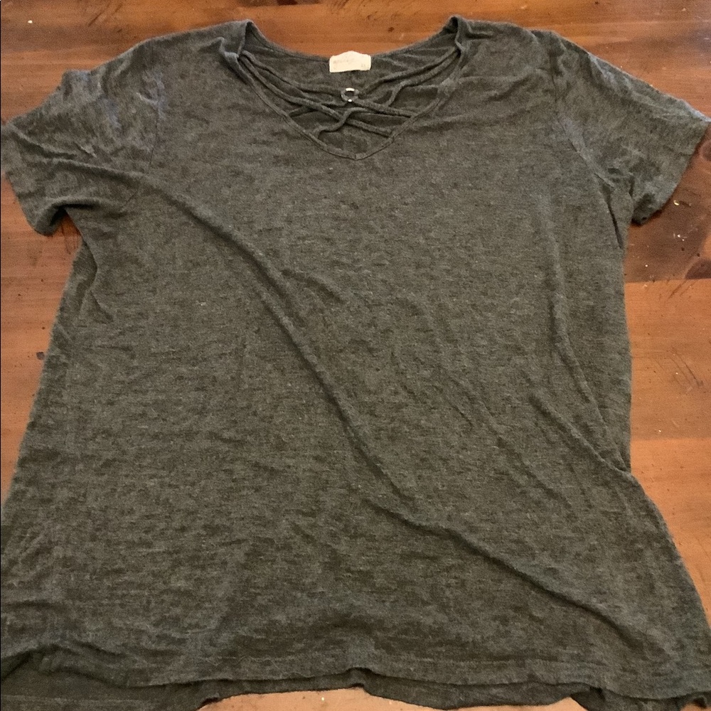 Cute grey shirt! Worn a couple times and has a v neck